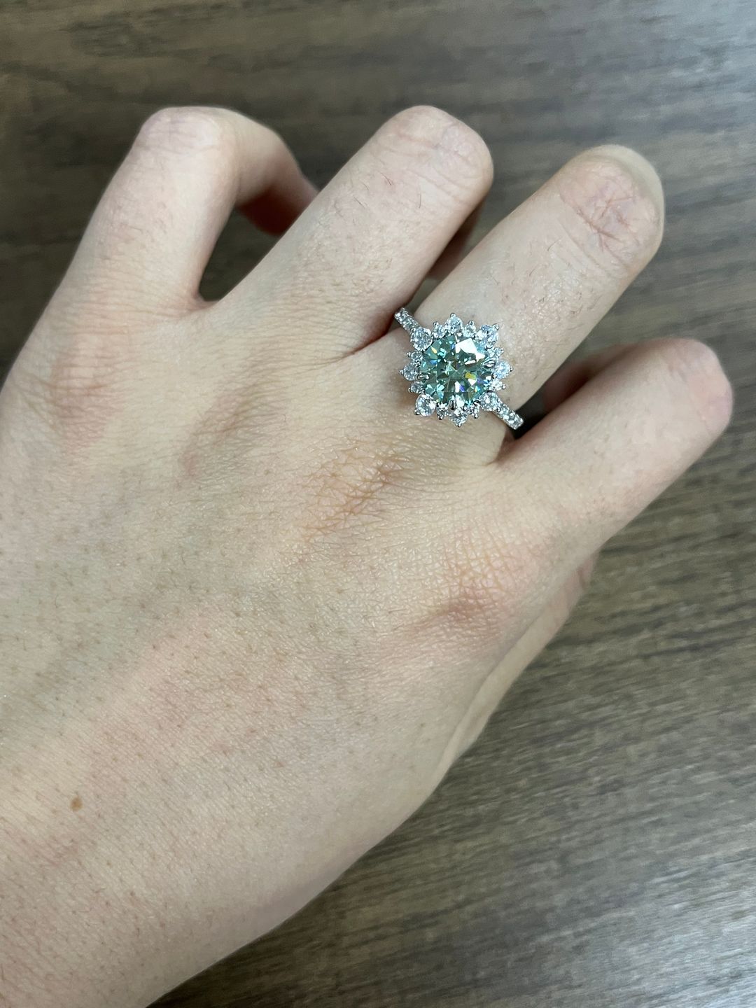 Customer photo review of S925 Moissanite 2 Ct Snowflake Design Halo Round Cyan Blue Stone Engagement Ring