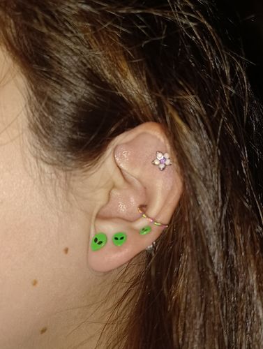 Customer photo review of Flower Cartilage and Tragus Ring with Opalite Petals