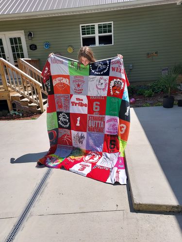 T-shirt quilt with sports, community events themes by Lori from AL