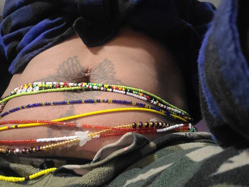 Customer photo review of Blue Glow in the Dark Waist Beads