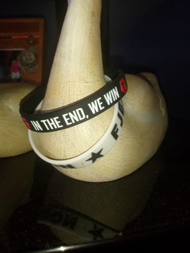 Customer photo review of "In The End, We Win!" Wristband