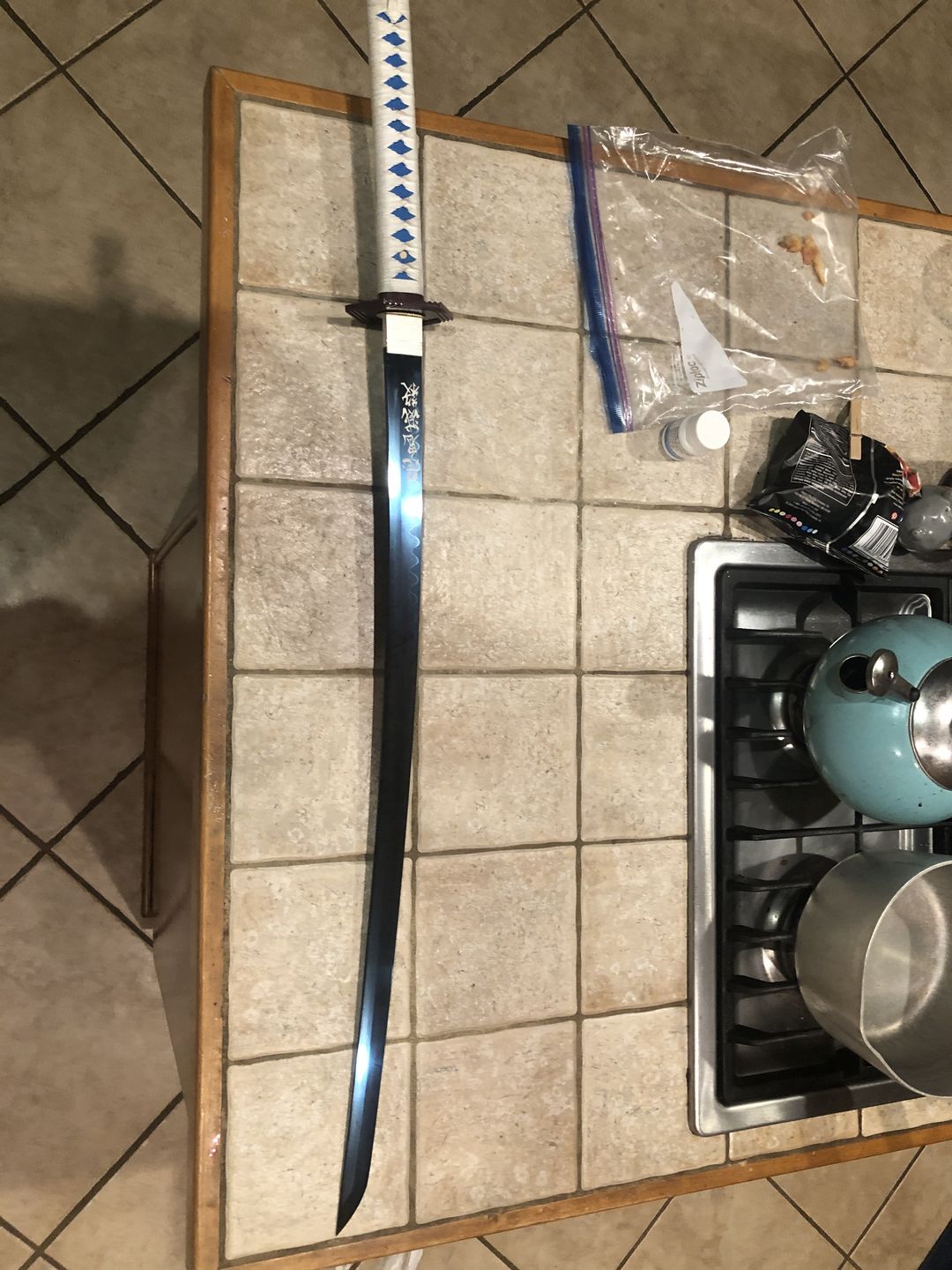 Customer photo review of The Giyuu Tomioka Handmade Katana Clay Tempered T10 Steel From Demon Slayer