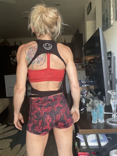 Customer photo review of Salty Savage™ Ladies Micro Ribbed Seamless Open Back Cropped Racerback Tank | Black