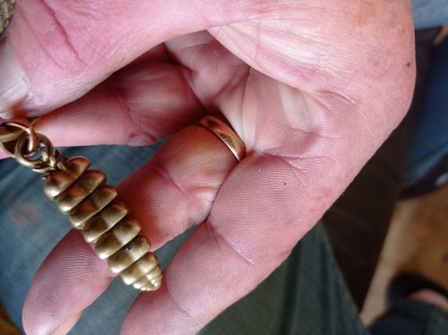 Customer photo review of Brass Rattlesnake Tail Pendant