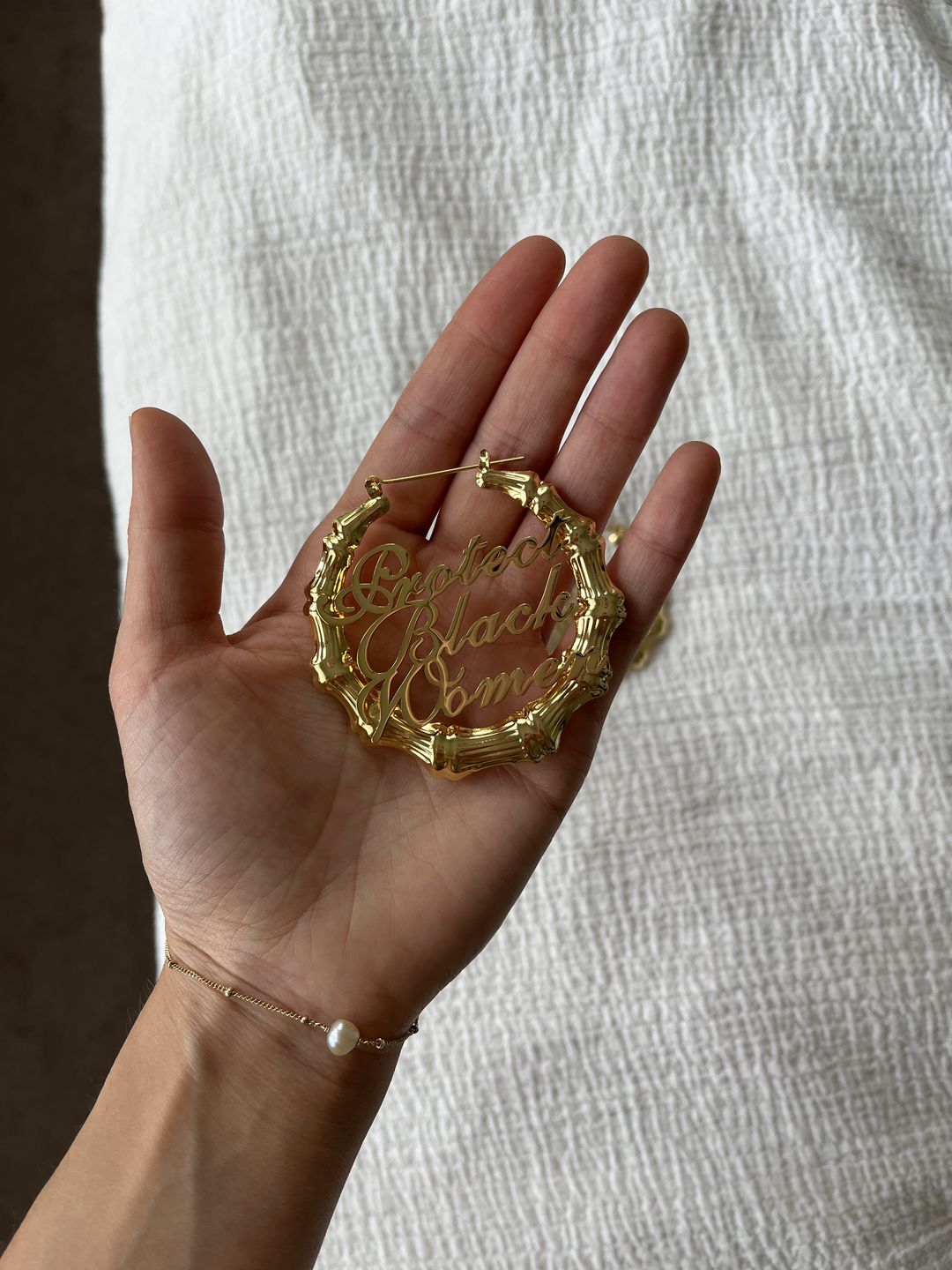 Customer photo review of 18k Gold Plated Protect Black Women Bamboo Hoop Earrings