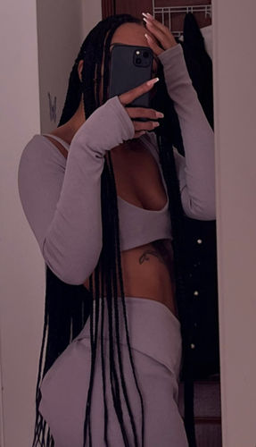 Customer photo review of Two Piece Thumb Hole Crop Top & Asymmetrical Skirt Set