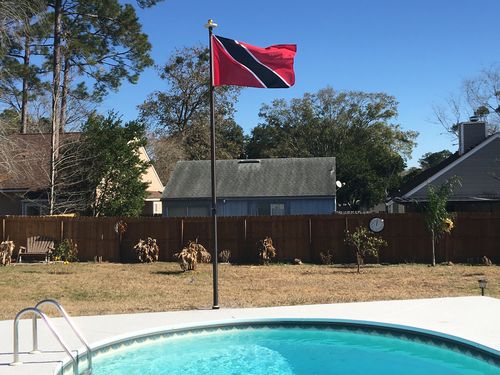 Customer photo review of 15 FT.  Commercial Aluminum Flagpole with External Rope Halyard Rated At 120 mph