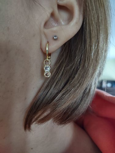 Customer photo review of Eleanor Topaz Huggie Earrings
