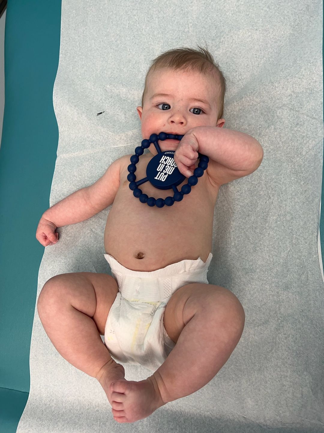 Customer photo review of Put Me In Coach Happy Teether
