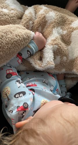 Customer photo review of Tan & White Cow Print Extended Throw