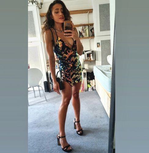 Customer photo review of Colorful Sequin Plunging Neck Lace Up Hem Mini Dress