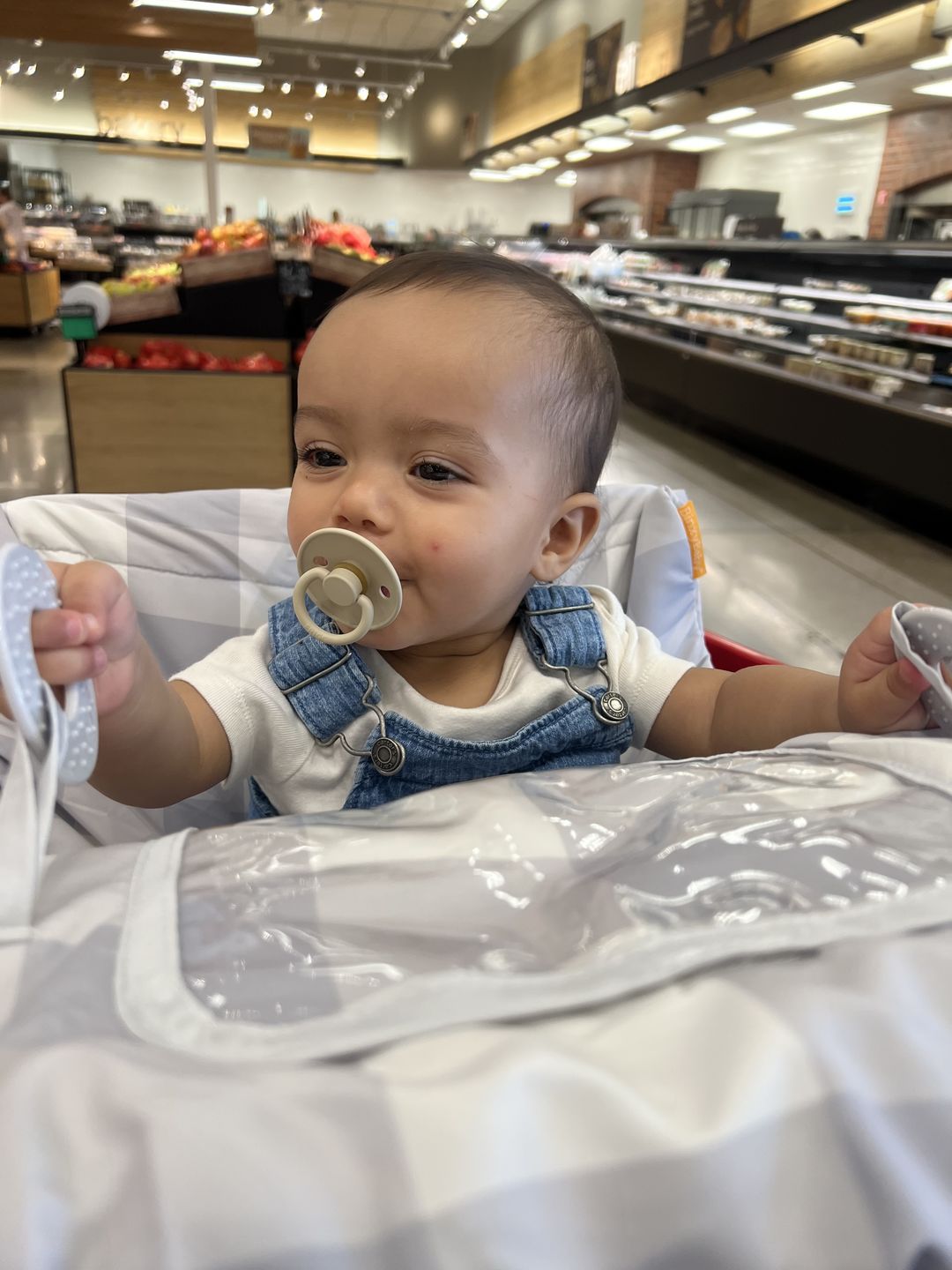 Customer photo review of Baby Shopping Cart Cover - Buffalo Check
