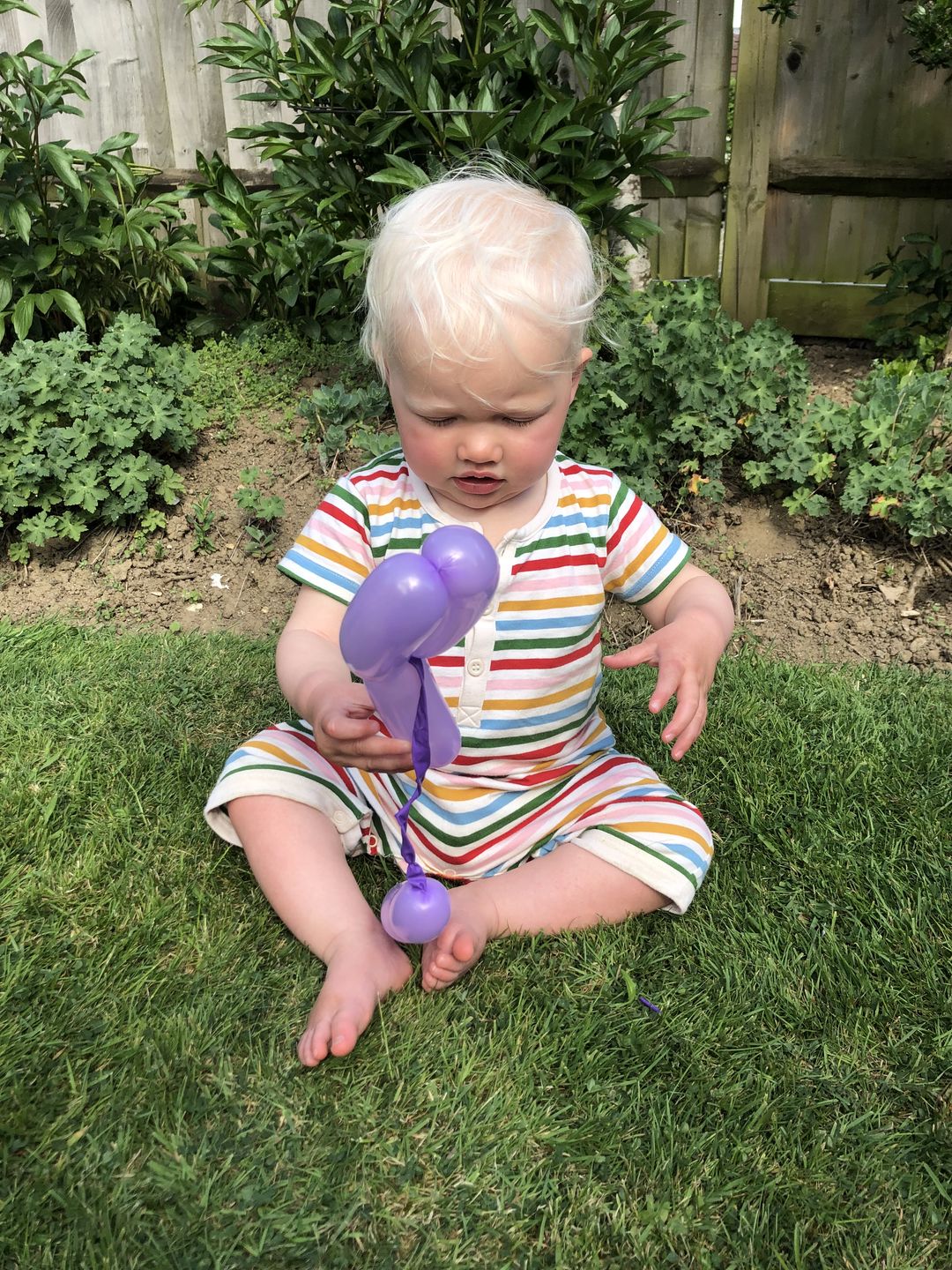 Customer photo review of Rainbow Striped Organic Romper Playsuit