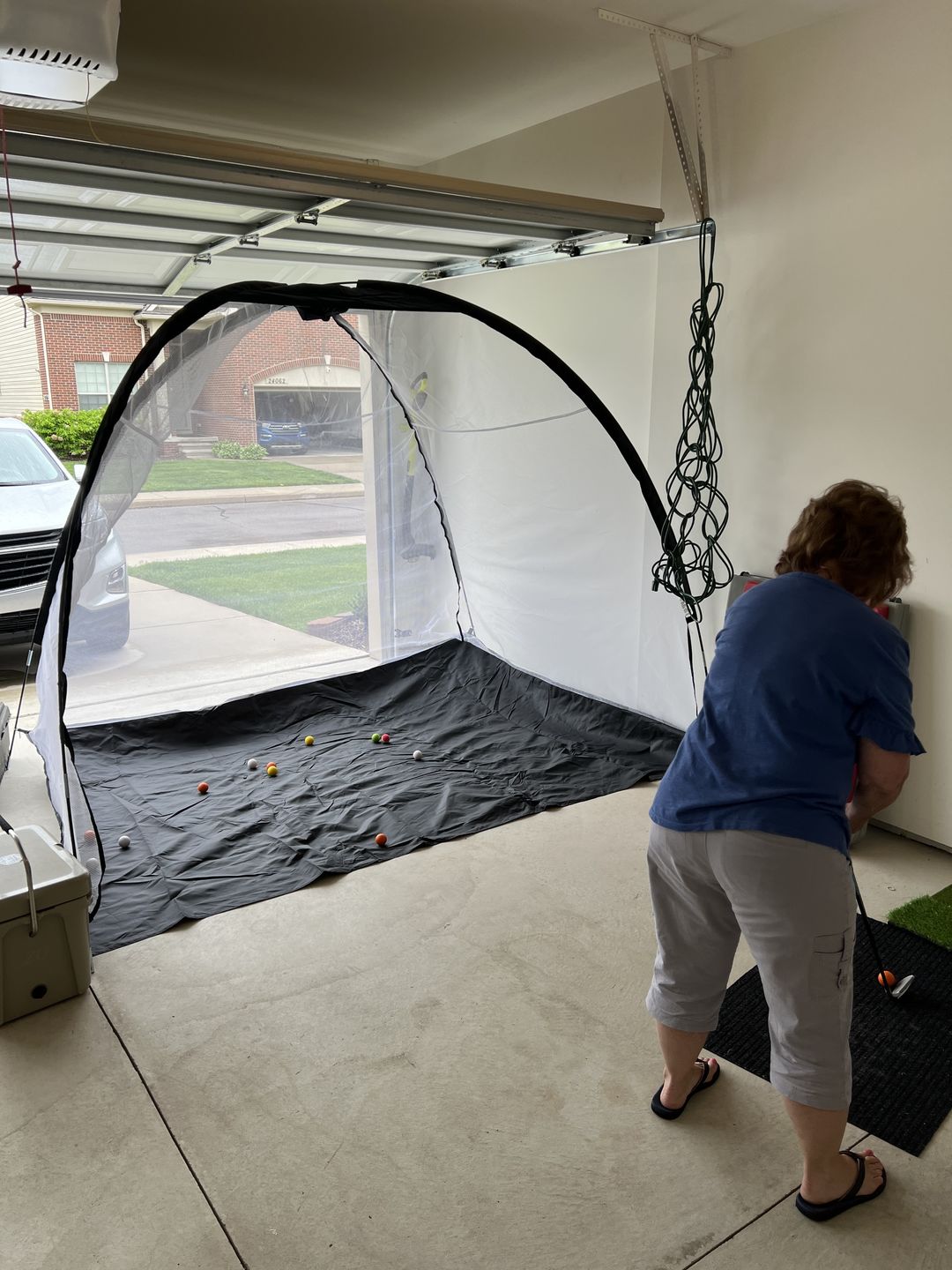 Customer photo review of Golf Practice Driving Net for Indoors and Outdoors | Tri-Turf Hitting Mat