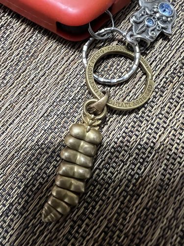 Customer photo review of Brass Rattlesnake Tail Pendant