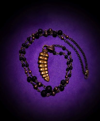 Customer photo review of Brass Rattlesnake Tail Pendant