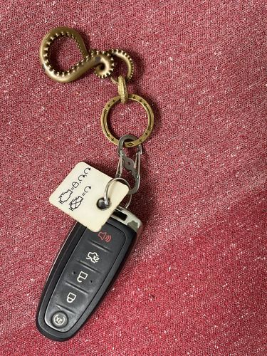 Customer photo review of Brass Octopus Tentacle Keychain