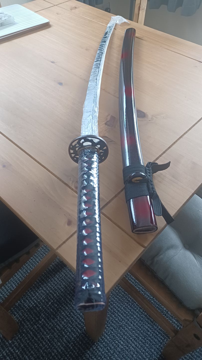 Customer photo review of Japanese Samurai Sword KATANA 1060 High Carbon Steel Can Cut Tree