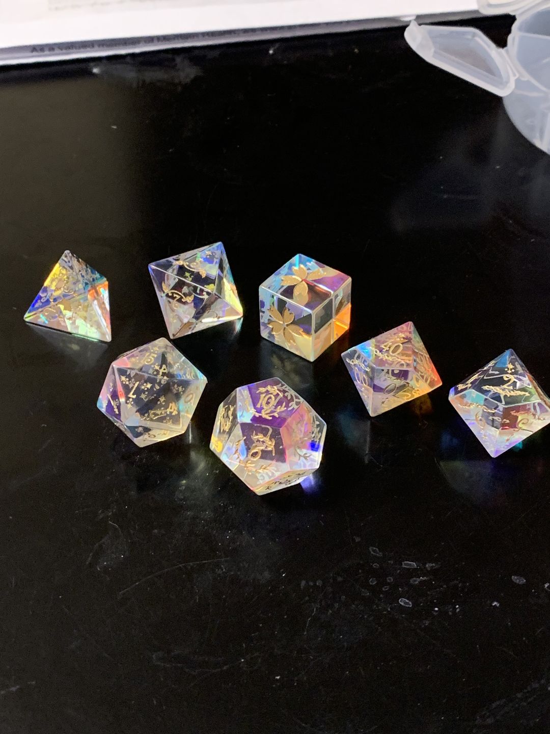 Customer photo review of URWizards D&D Dichroic Prism  Glass Engraved Dice Set Unicorn Style