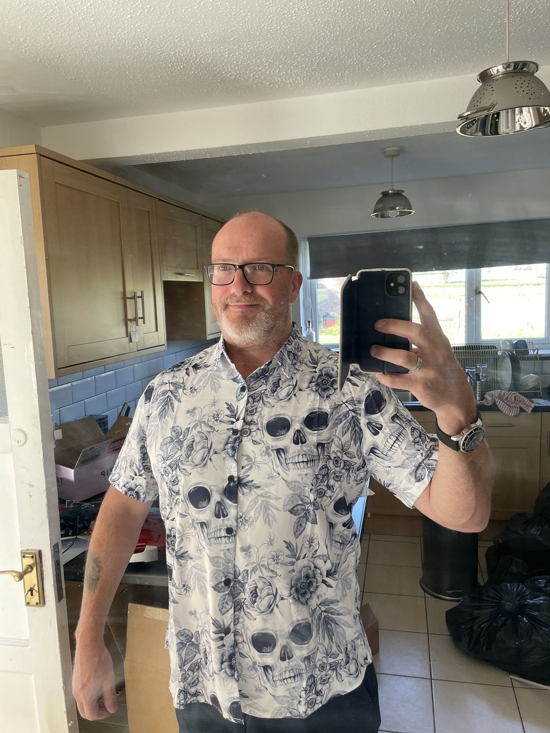 Customer photo review of Men's Skull Floral Print Casual Lapel Button Short Sleeve Shirt