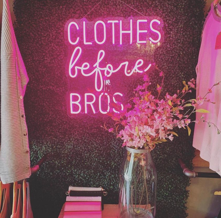 Customer photo review of Clothes Before Bros Neon Sign