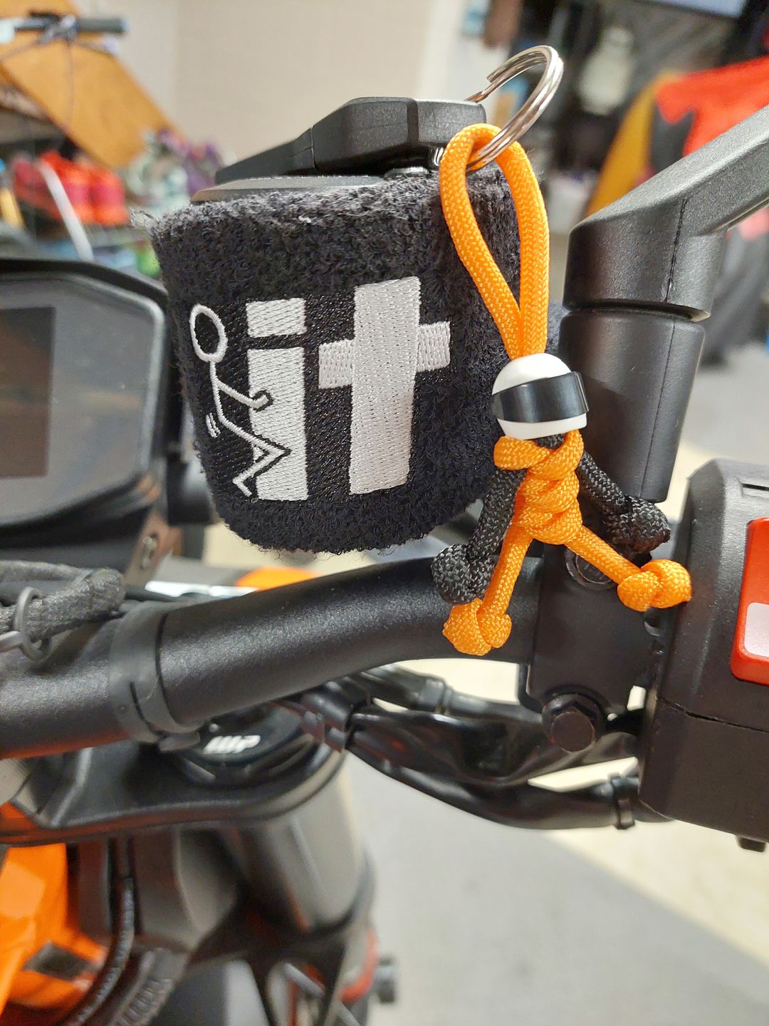 Customer photo review of Orange Biker Buddy Paracord Keychain