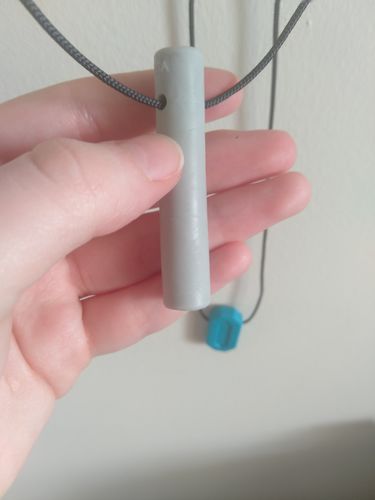 Customer photo review of ARK's Bite Tube Hollow Chew Necklace