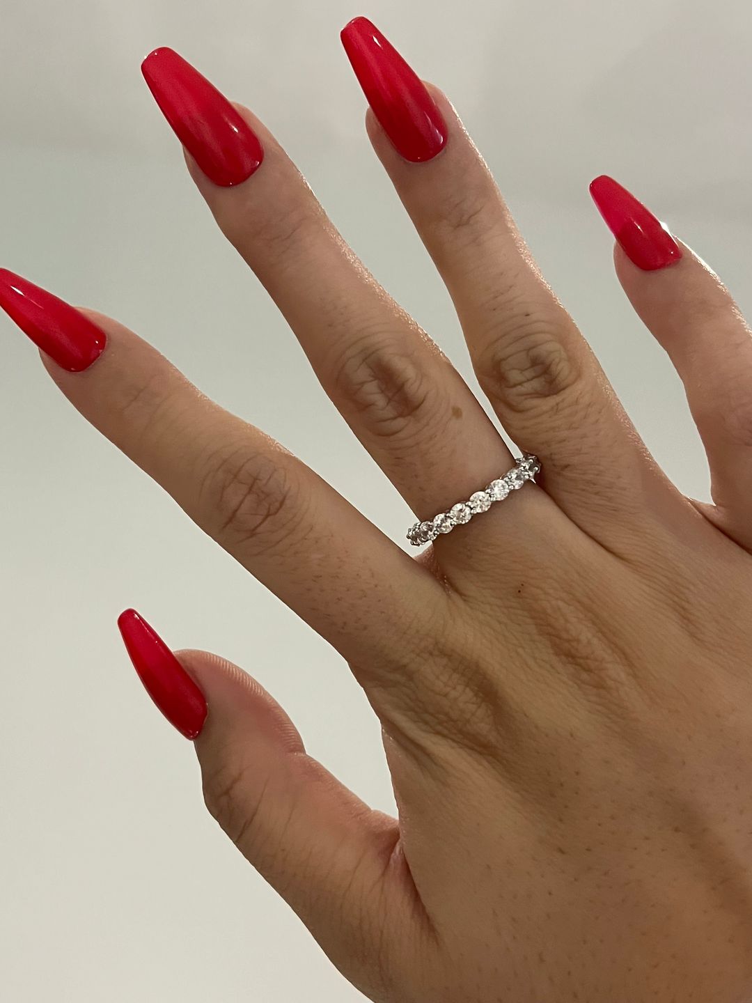 Customer photo review of Louily Eternity Round Cut Simulated Diamond Wedding Band In Sterling Silver