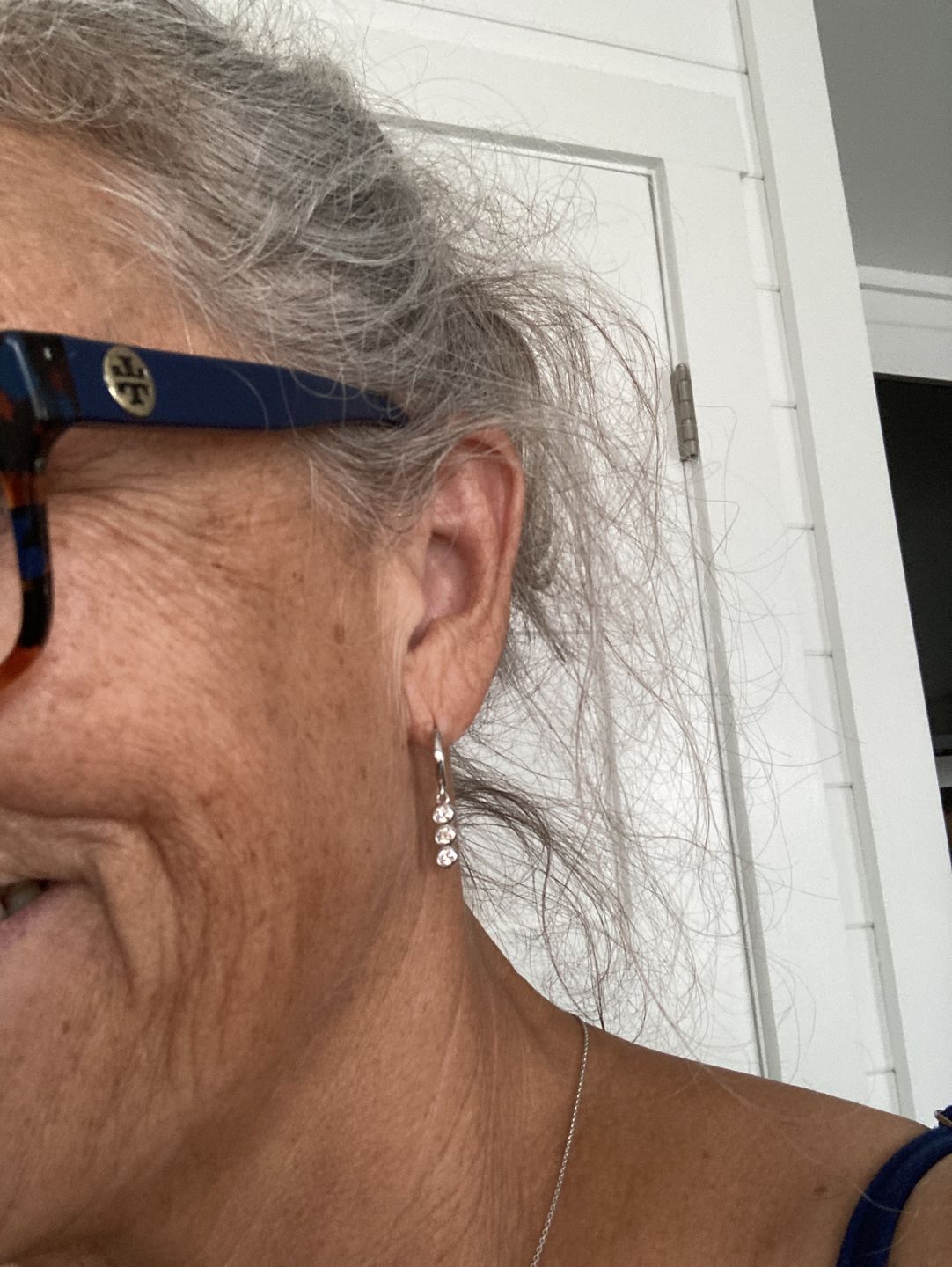Customer photo review of Three Stone Moissanite Drop Earrings In Sterling Silver