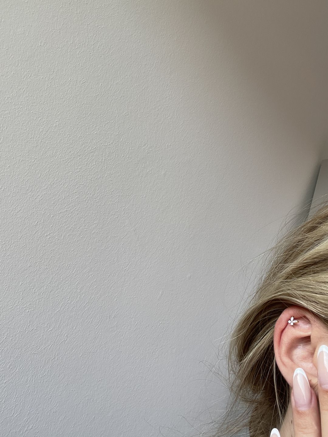 Customer photo review of Butterfly Piercing | Titan