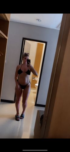 Customer photo review of Melanoboost Peptide Sun Tanning Oil
