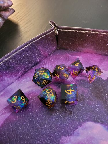 Customer photo review of Sharp Edge Purple Glitter Resin DnD Dice Set Fuck Me Fuck You Dice