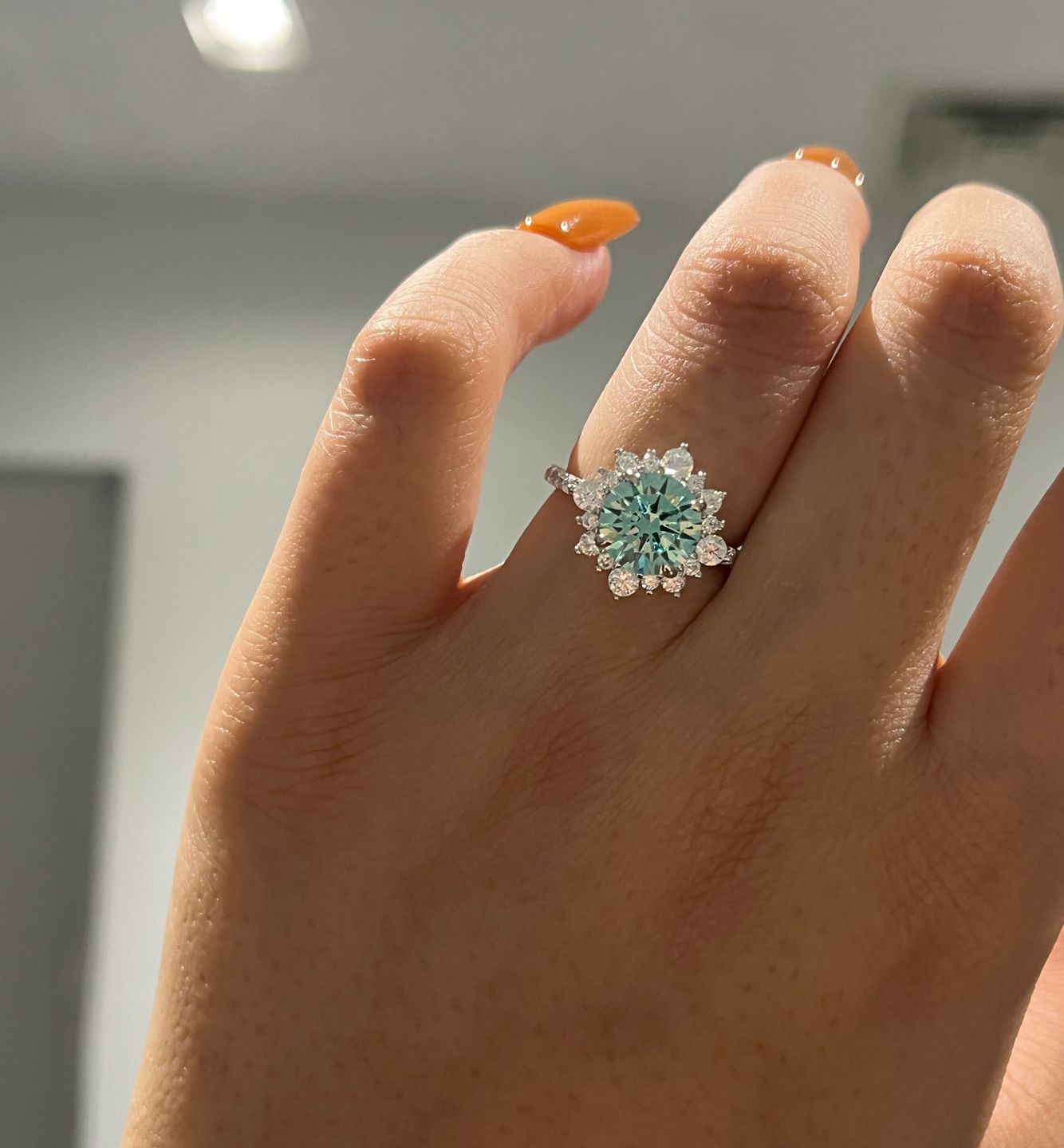 Customer photo review of S925 Moissanite 2 Ct Snowflake Design Halo Round Cyan Blue Stone Engagement Ring