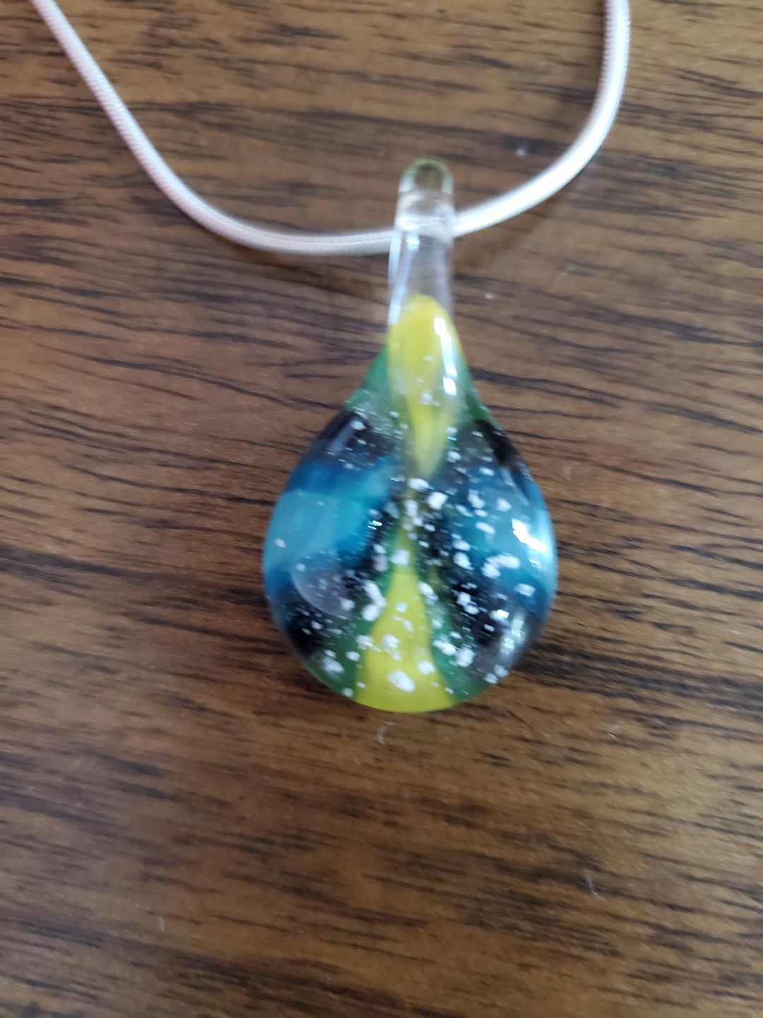 Customer photo review of Ocean Sunset Pendant with Infused Cremation Ashes