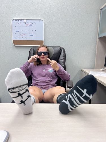 Customer photo review of Salty Savage Unisex “FUCK OFF” Mix Matched Crew Socks | Black/White