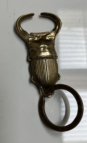 Customer photo review of Brass Beetle Bottle Opener