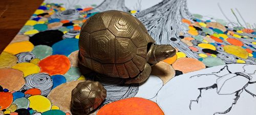 Customer photo review of Brass Tortoise Bell Pendant