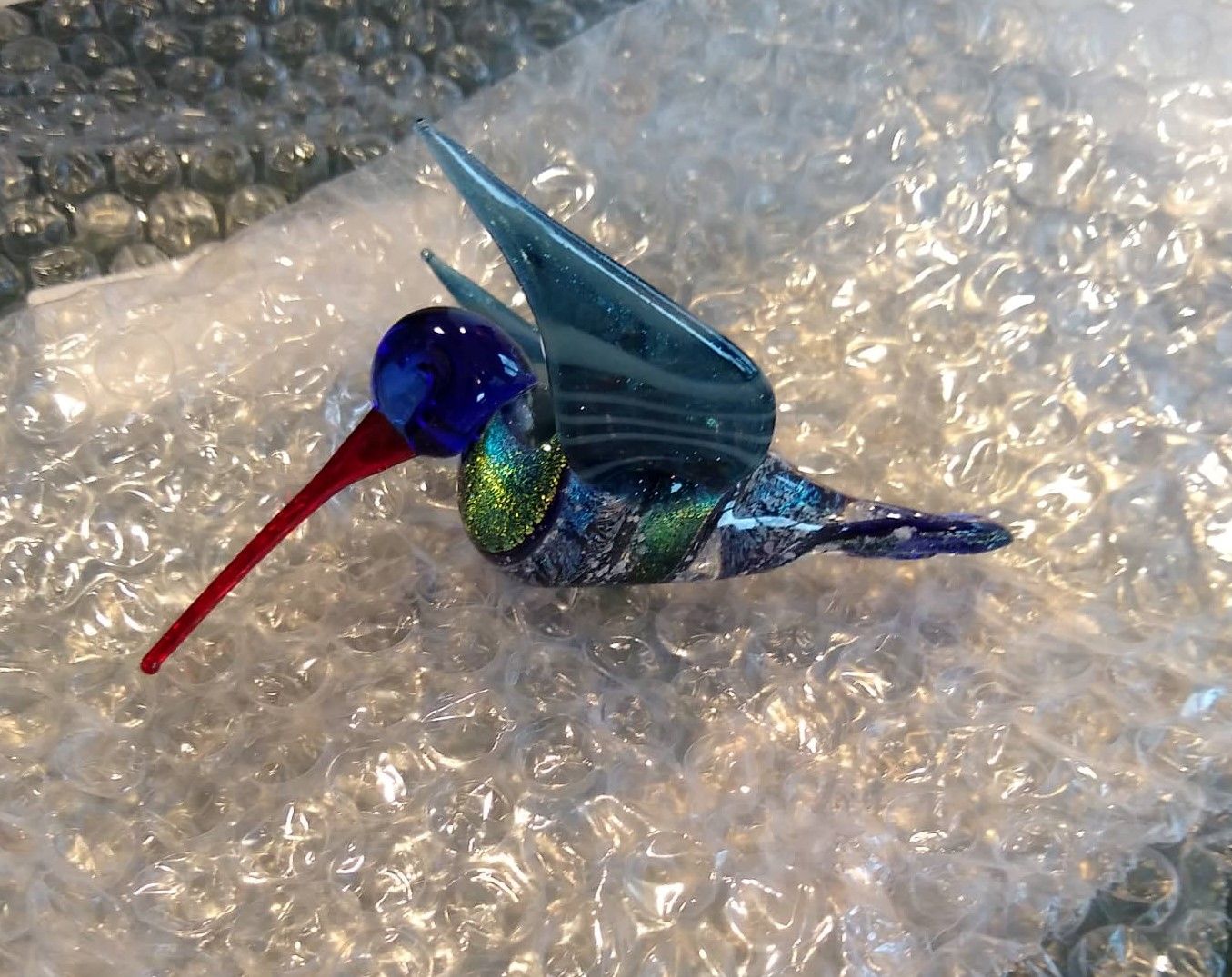 Customer photo review of Dichroic Twist Glass Hummingbird with Infused Ash