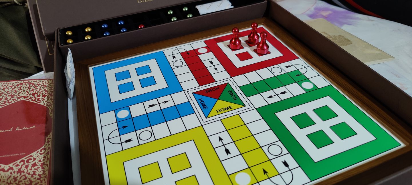 Customer photo review of Teakwood Ludo With Metallic Tokens