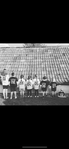 Customer photo review of Cousin Squad Number Tees