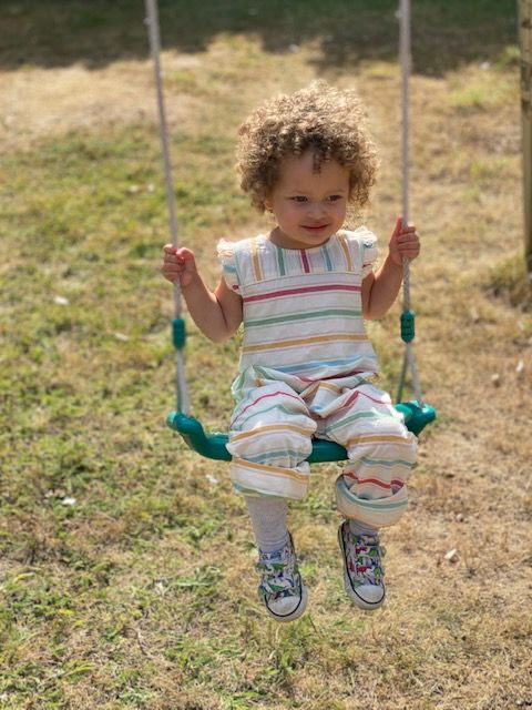Customer photo review of Rainbow Striped Organic Summer Romper