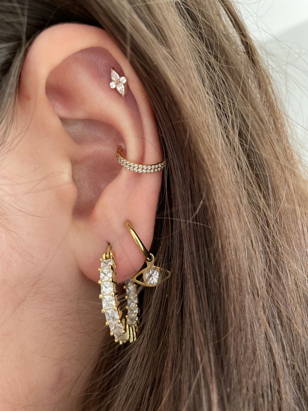 Customer photo review of Double Conch Piercing | Titan
