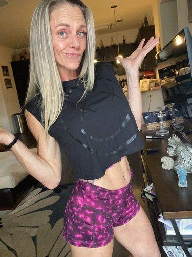 Customer photo review of Salty Savage Ladies OG Smile Sleeveless Muscle Crop Top | Black on Black