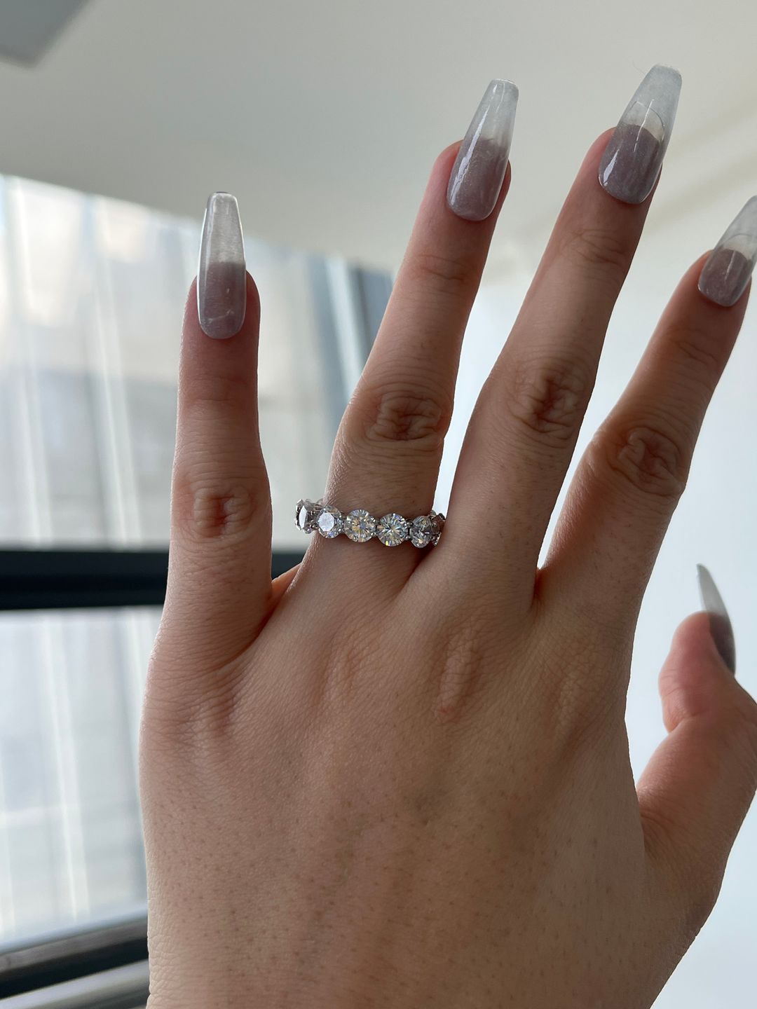 Customer photo review of Louily Classic Eternity Round Cut Women's Wedding Band In Sterling Silver