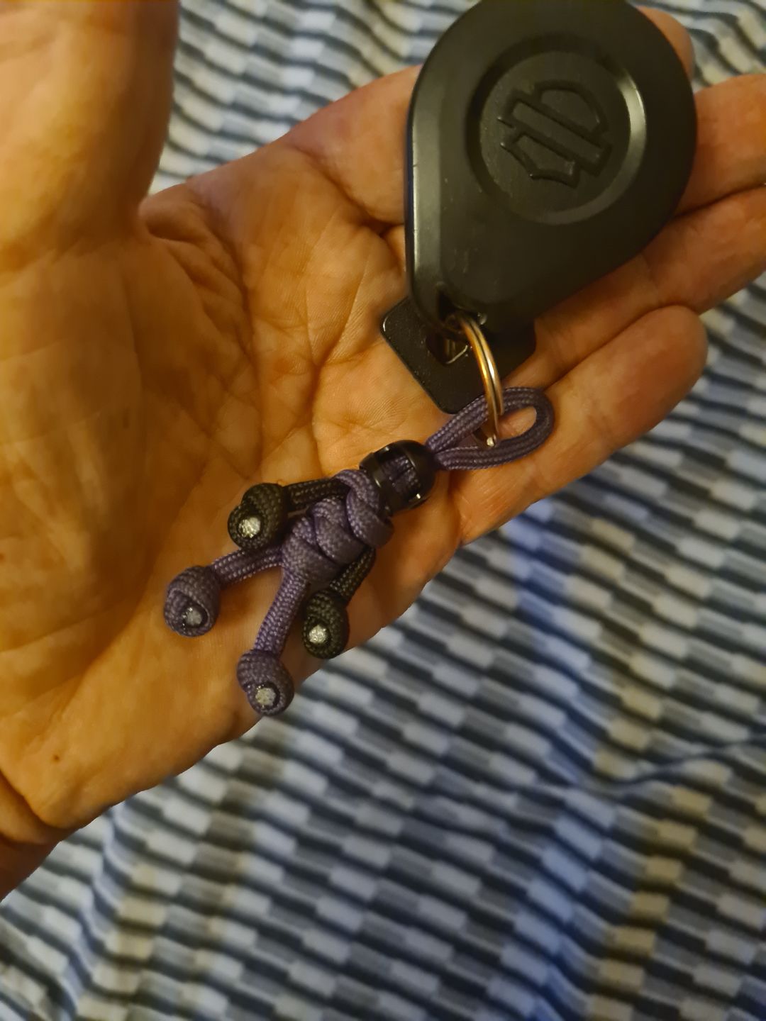 Customer photo review of Black Purple Biker Buddy Paracord Keychain