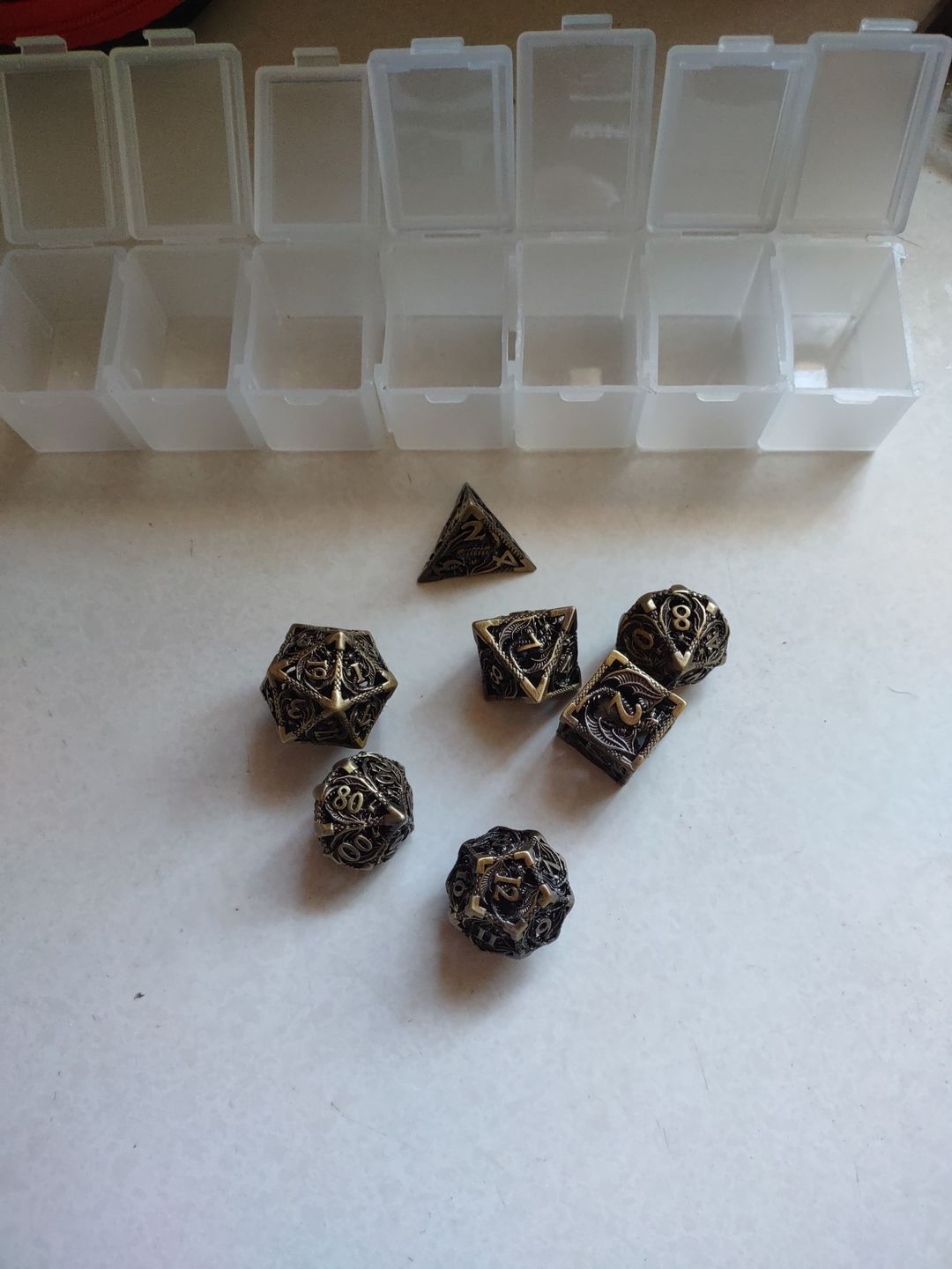 Customer photo review of URWizards D&D Hollowed Metal Dice Set Dragon