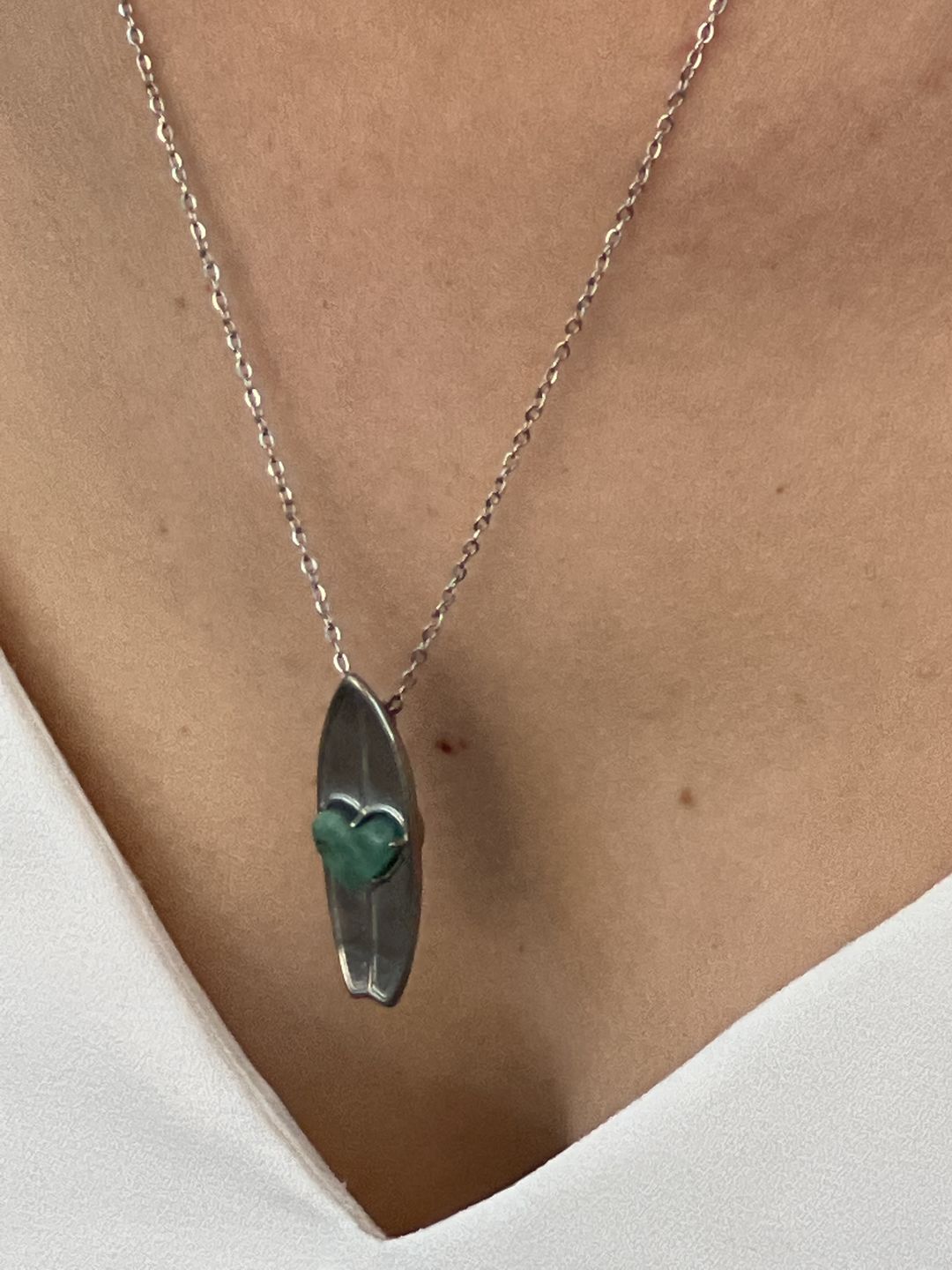 Customer photo review of MAY Birthstone Surfboard Necklace in Emerald