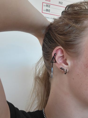 Customer photo review of Triangle Dangle Cartilage Ring