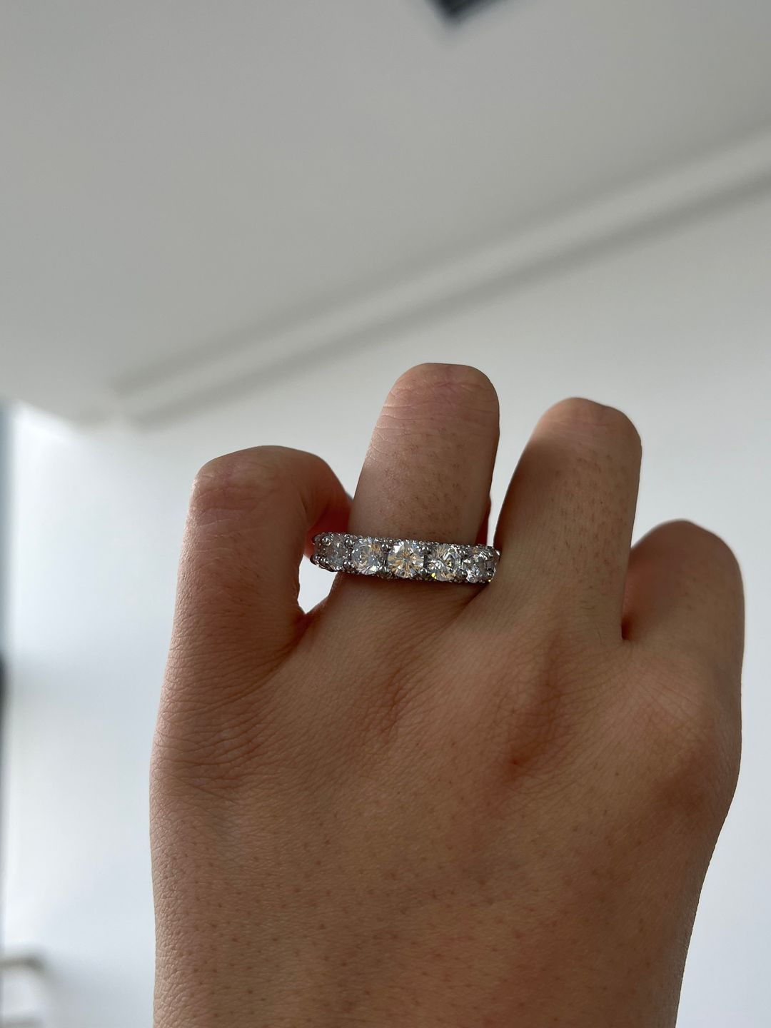 Customer photo review of Louily 5 Ct Luxury Eternity Round Cut Wedding Band In Sterling Silver