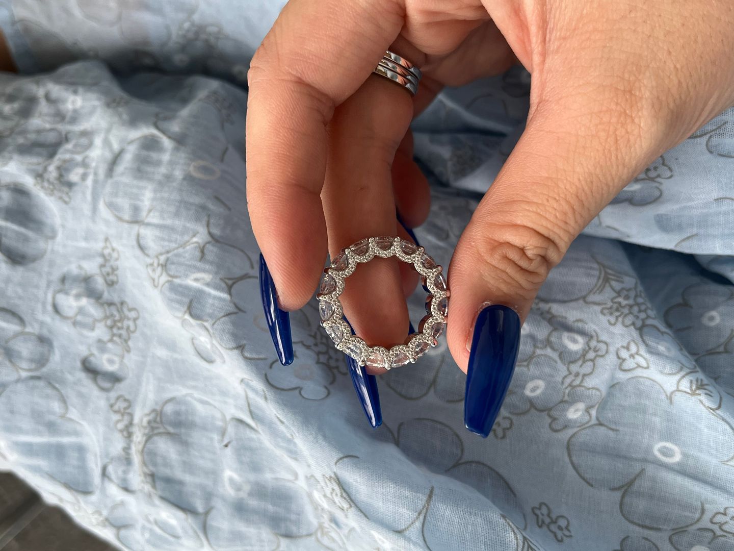 Customer photo review of Louily 5 Ct Luxury Eternity Round Cut Wedding Band In Sterling Silver